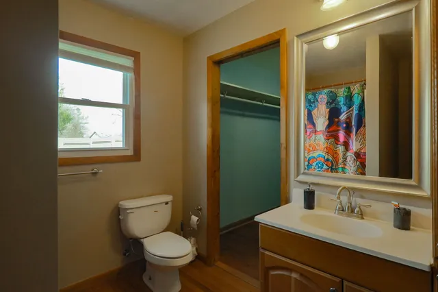 a view of a room with wooden floor