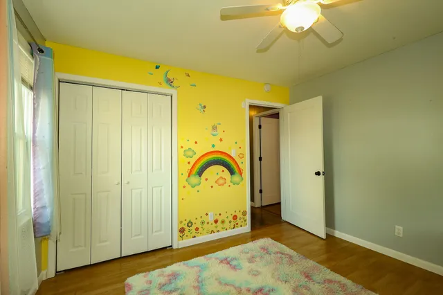 a view of a hallway with a door and couch