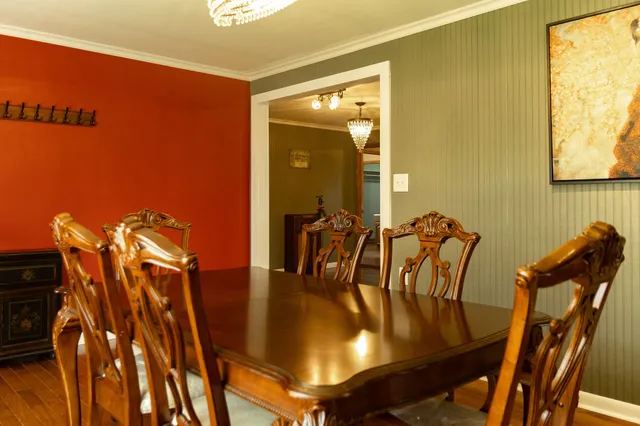 a view of furniture in a room with wooden floor