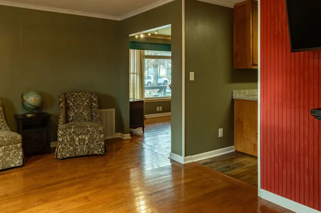 a living room with furniture and a window