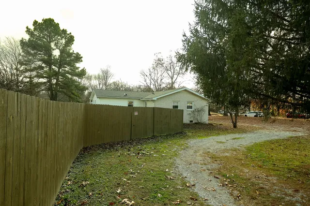 a view of a large garden with a bench
