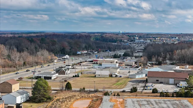a view of a house with car parked