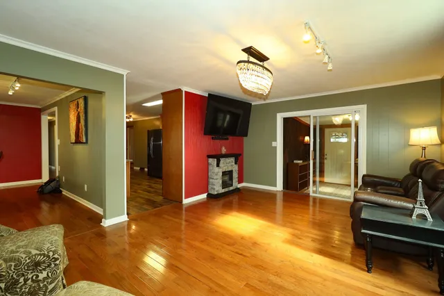 a kitchen with granite countertop stainless steel appliances a refrigerator and cabinets