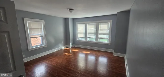 a view of a brick house with a large window