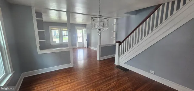a white toilet sitting next to a sink