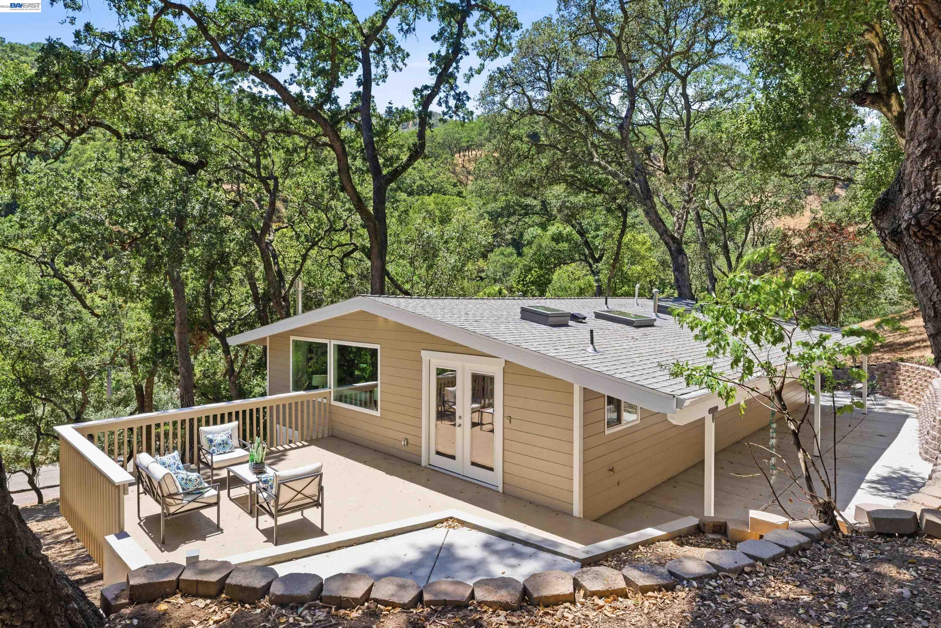 1929 Kilkare Road Sunol, CA 94586 - Photo 5 of 24 a roof deck with table and chairs under an umbrella