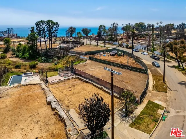 a view of a swimming pool with a table and chairs