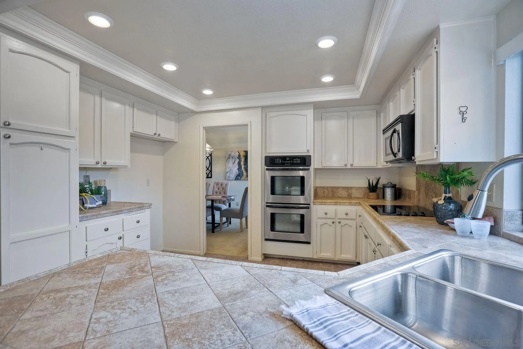 17834 St Andrews Drive Poway, CA 92064 - Photo 11 of 38 a kitchen with refrigerator cabinets and stove