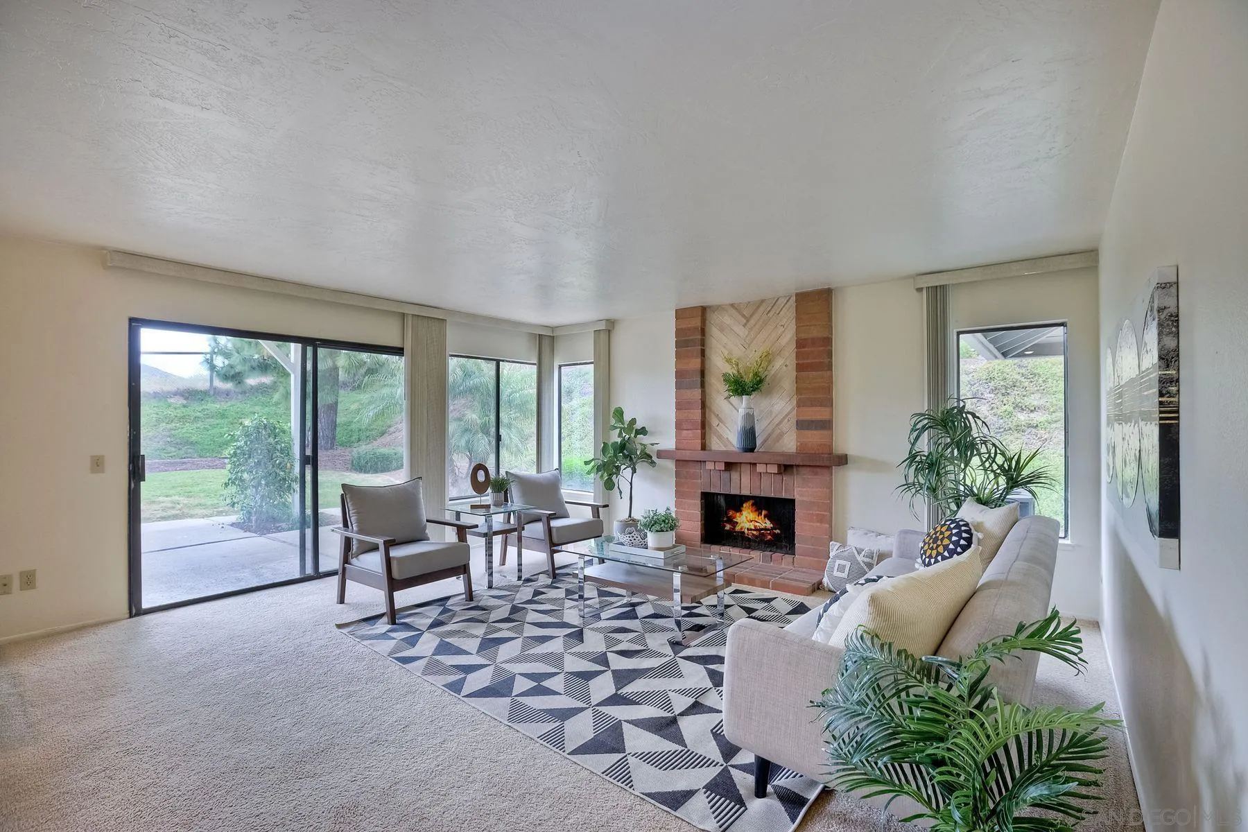 17834 St Andrews Drive Poway, CA 92064 - Photo 16 of 38 a living room with furniture large window and fireplace