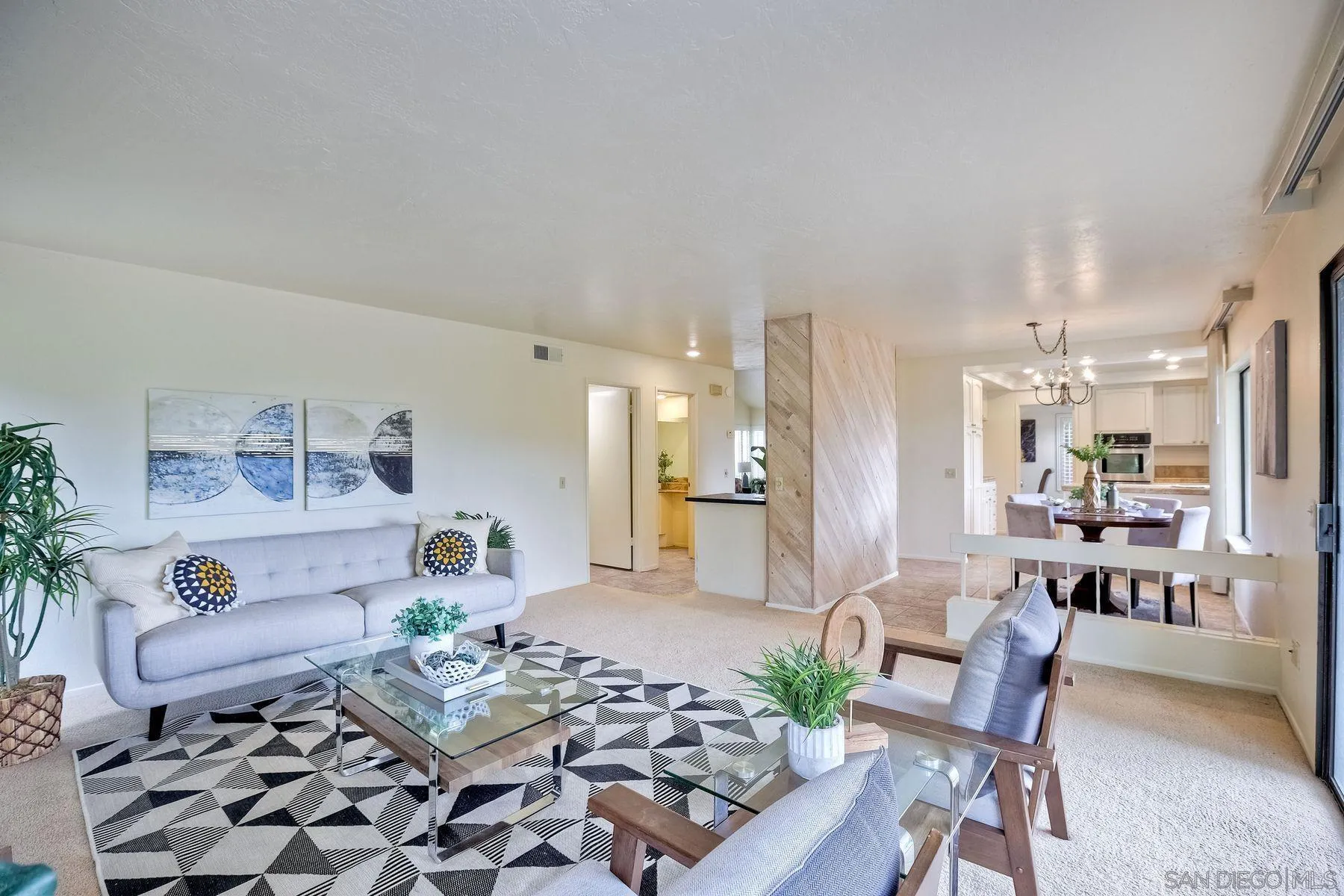 17834 St Andrews Drive Poway, CA 92064 - Photo 17 of 38 a living room with furniture and a dining table with kitchen view