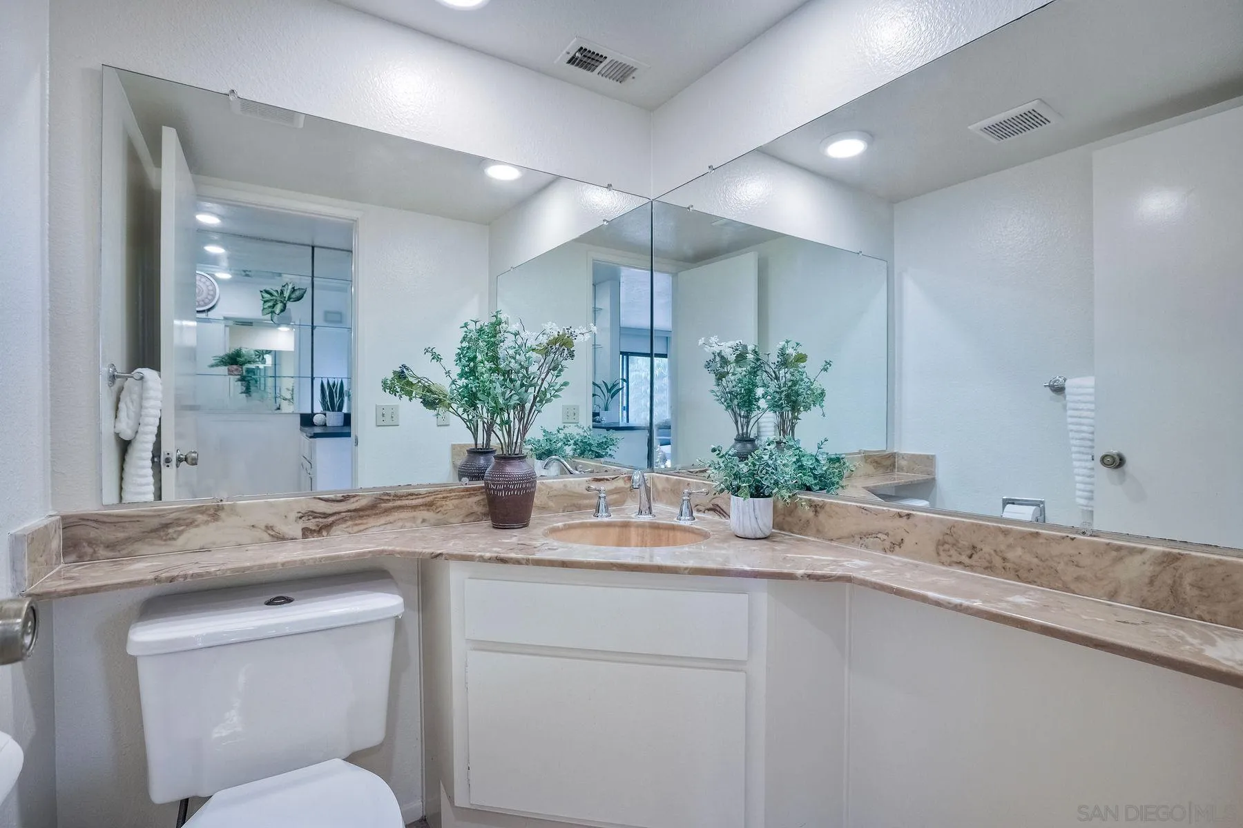 17834 St Andrews Drive Poway, CA 92064 - Photo 19 of 38 a bathroom with a granite countertop sink a toilet and mirror
