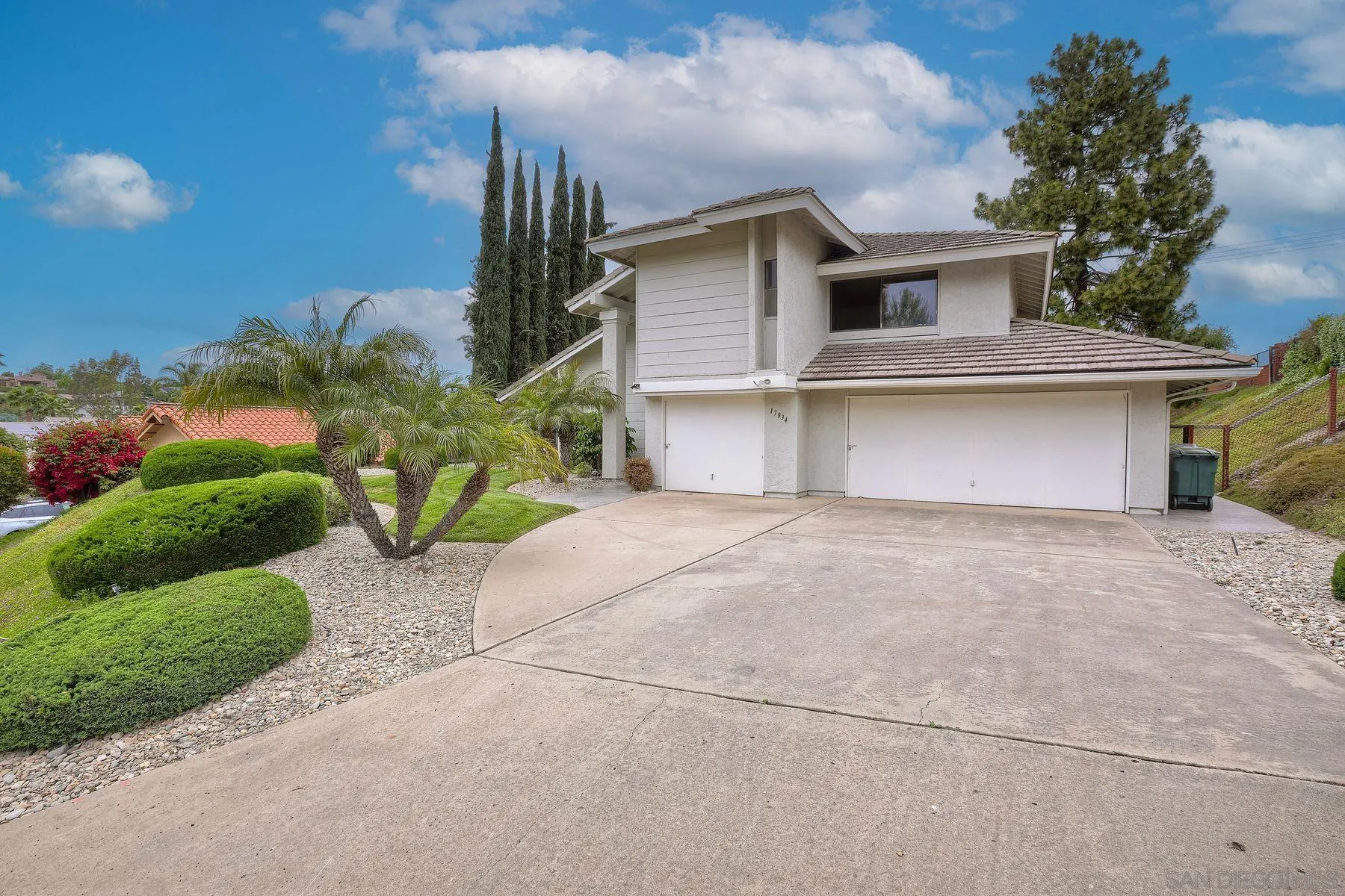 17834 St Andrews Drive Poway, CA 92064 - Photo 2 of 38 a front view of a house with a yard and garage