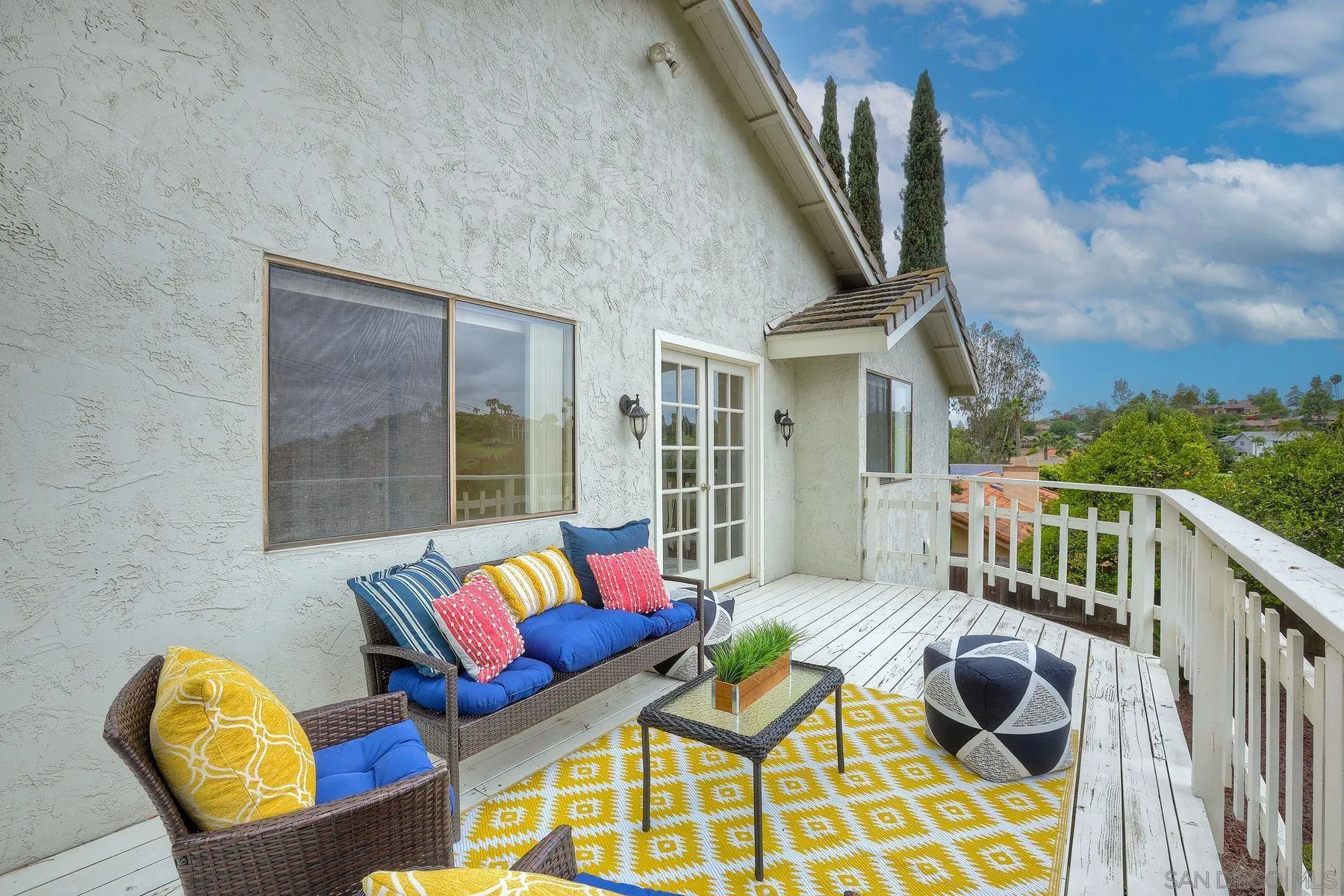 17834 St Andrews Drive Poway, CA 92064 - Photo 24 of 38 a balcony with furniture and a floor to ceiling window