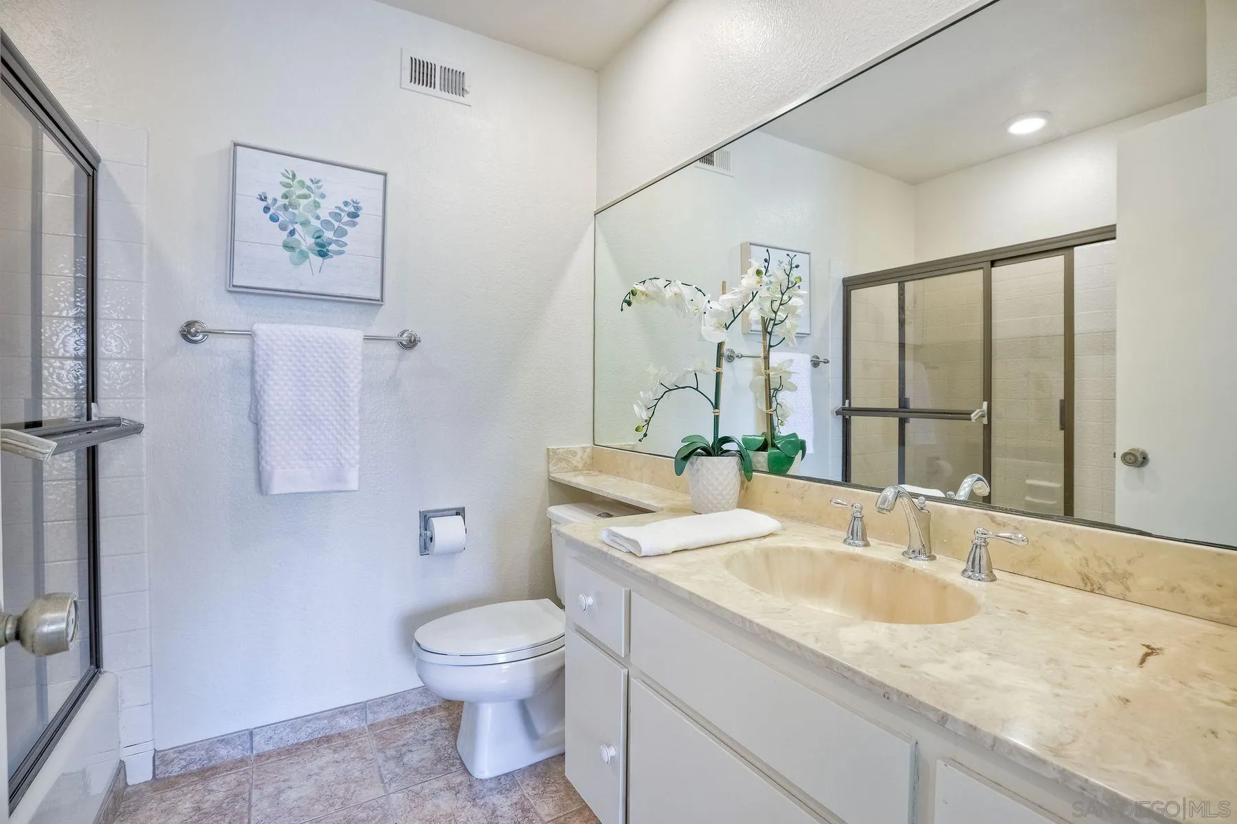 17834 St Andrews Drive Poway, CA 92064 - Photo 25 of 38 a bathroom with a granite countertop sink toilet and painting on the wall