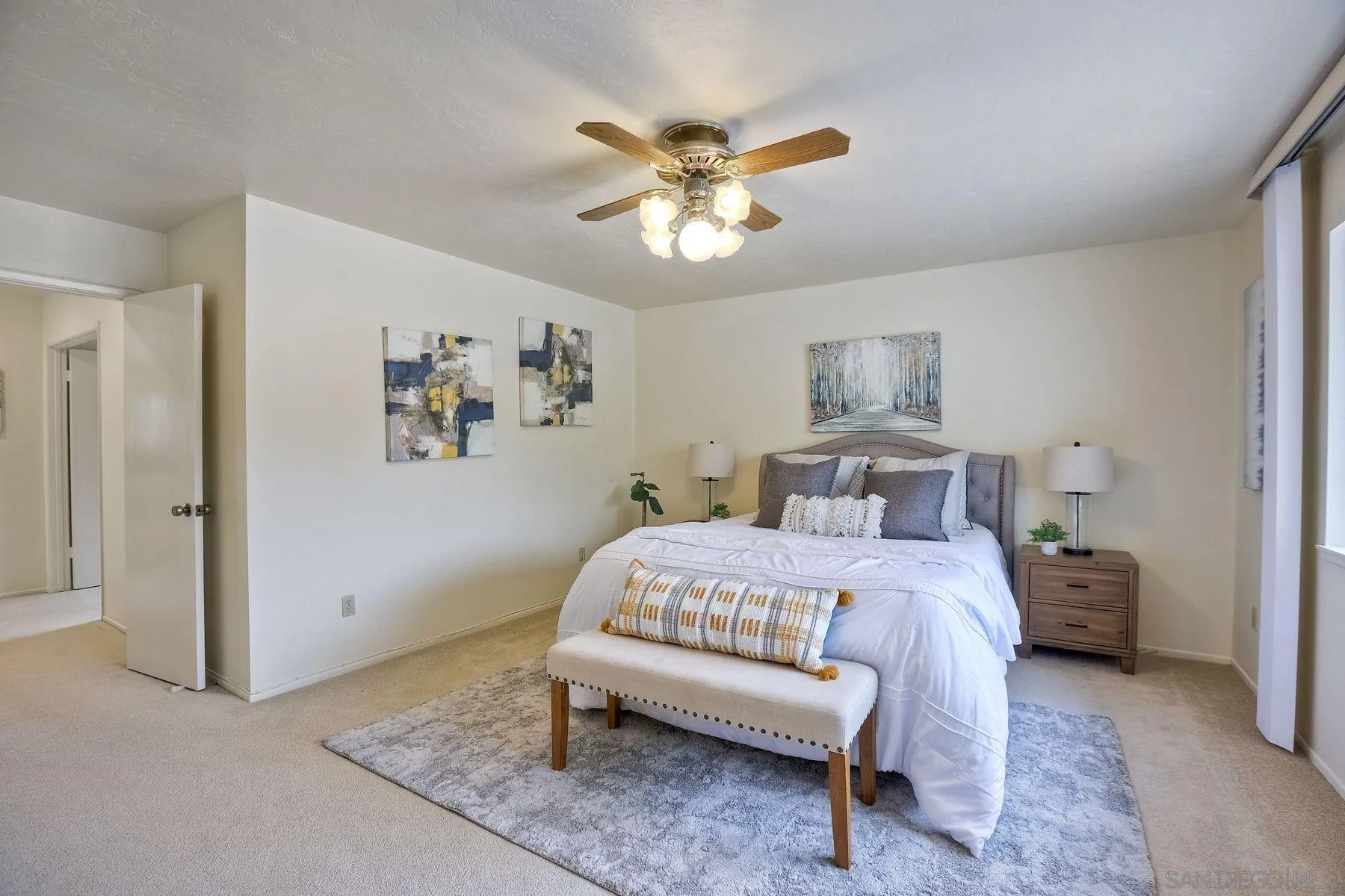 17834 St Andrews Drive Poway, CA 92064 - Photo 29 of 38 a bedroom with a bed and a chandelier