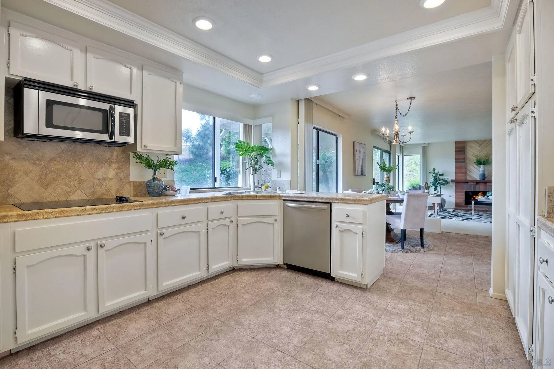 17834 St Andrews Drive Poway, CA 92064 - Photo 9 of 38 a kitchen with white cabinets and sink