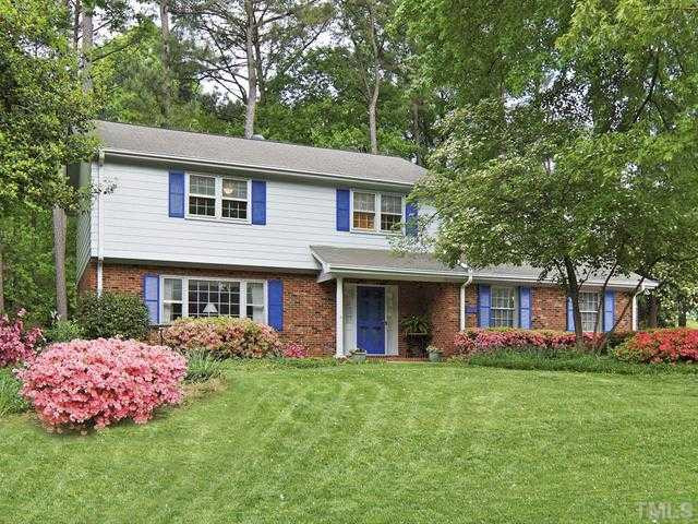 Beautifully landscaped yard with mature azaleas, trees, perennials Exterior Front