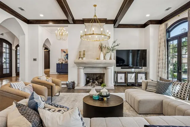 a living room with furniture a rug and a fireplace