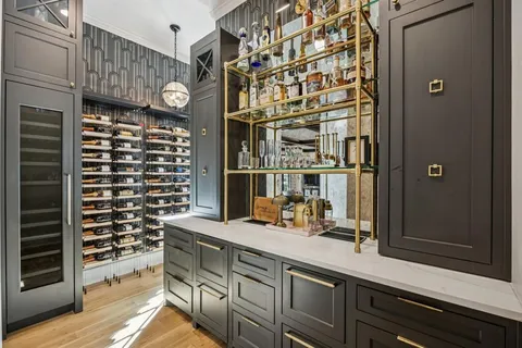 a bathroom with a sink a mirror and a shower