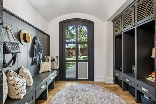 a dining table chair in a kitchen and a microwave