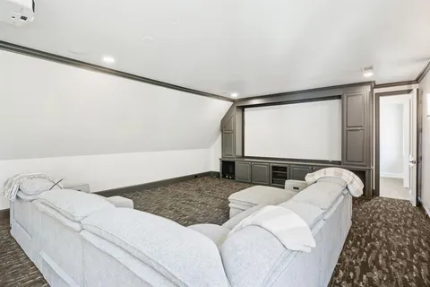 a view of hall way with furniture and a window