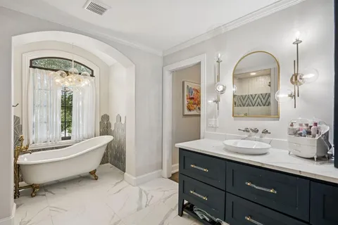 a view of a livingroom with furniture a flat screen tv and outdoor space