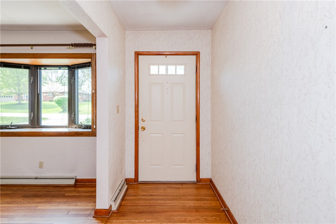 1176 Geneva Road Dayton, OH 45434 - Photo 5 of 55 Step inside this inviting entry with warm hardwood floors and a charming bay window.