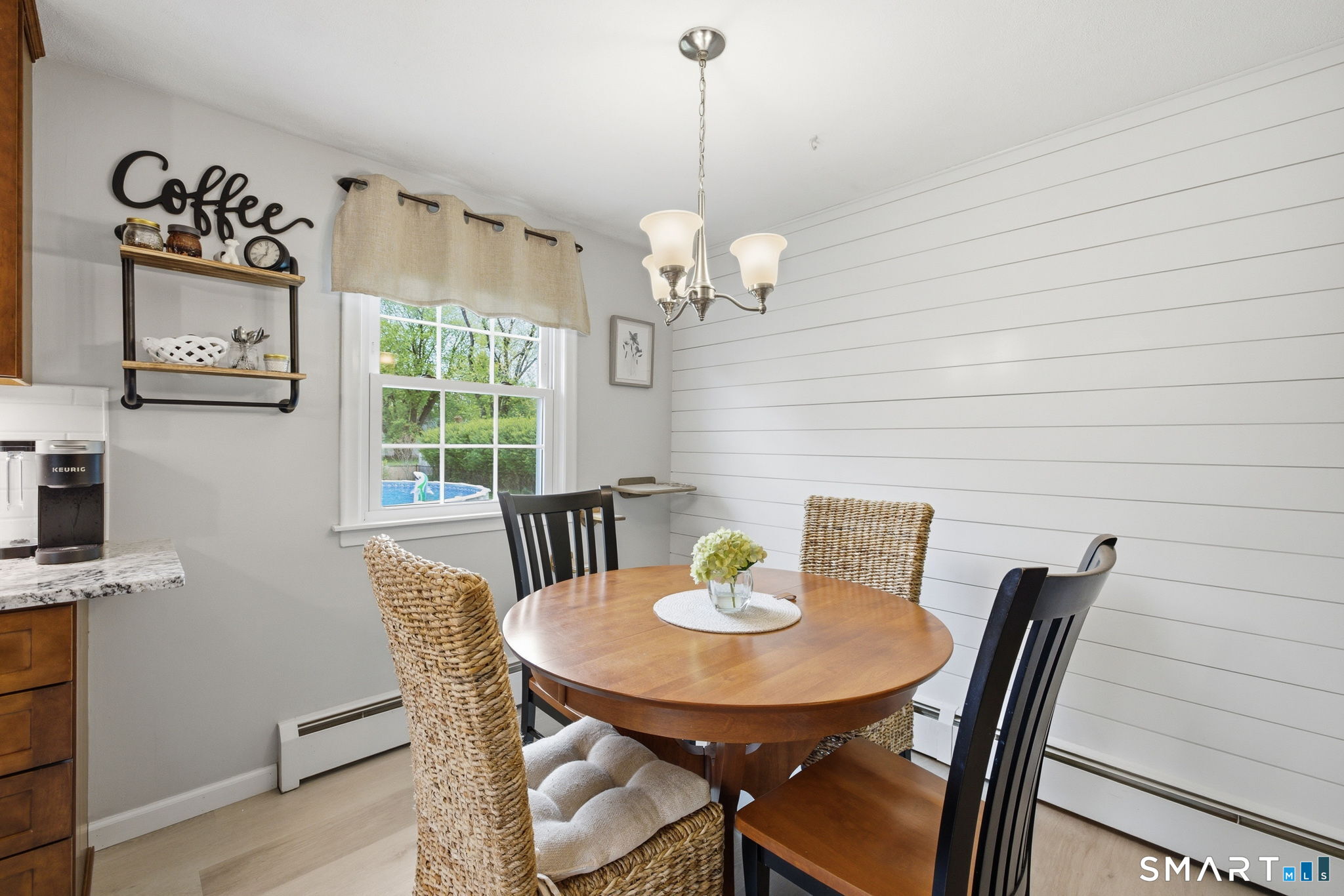 7 Stardust Drive Enfield, CT 06082 - Photo 7 of 38 a view of a dining room with furniture window and wooden floor