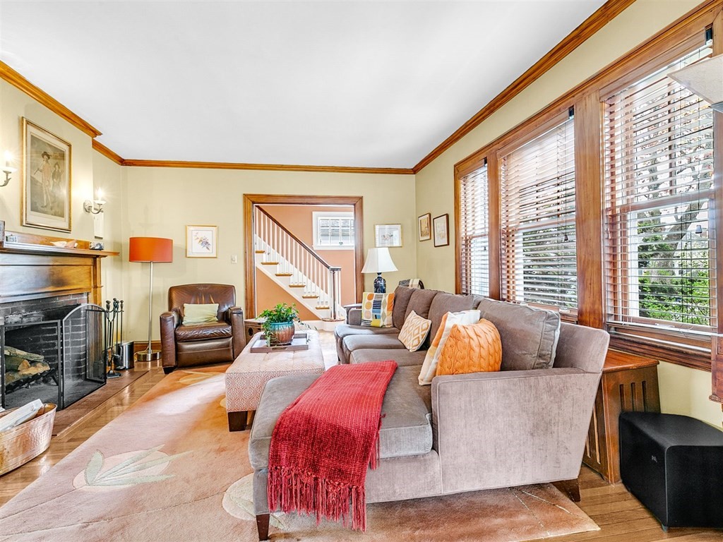 4 Brier Road Boston, MA 02132 - Photo 11 of 34 a living room with furniture and a large window