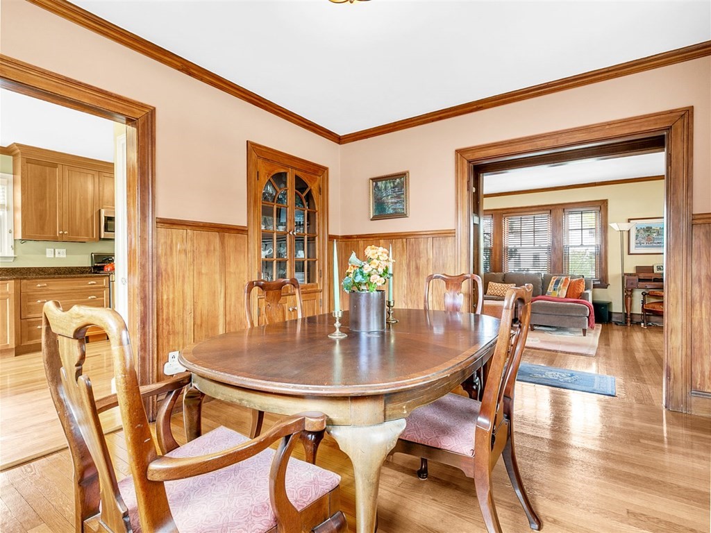 4 Brier Road Boston, MA 02132 - Photo 15 of 34 a dining room with furniture and wooden floor