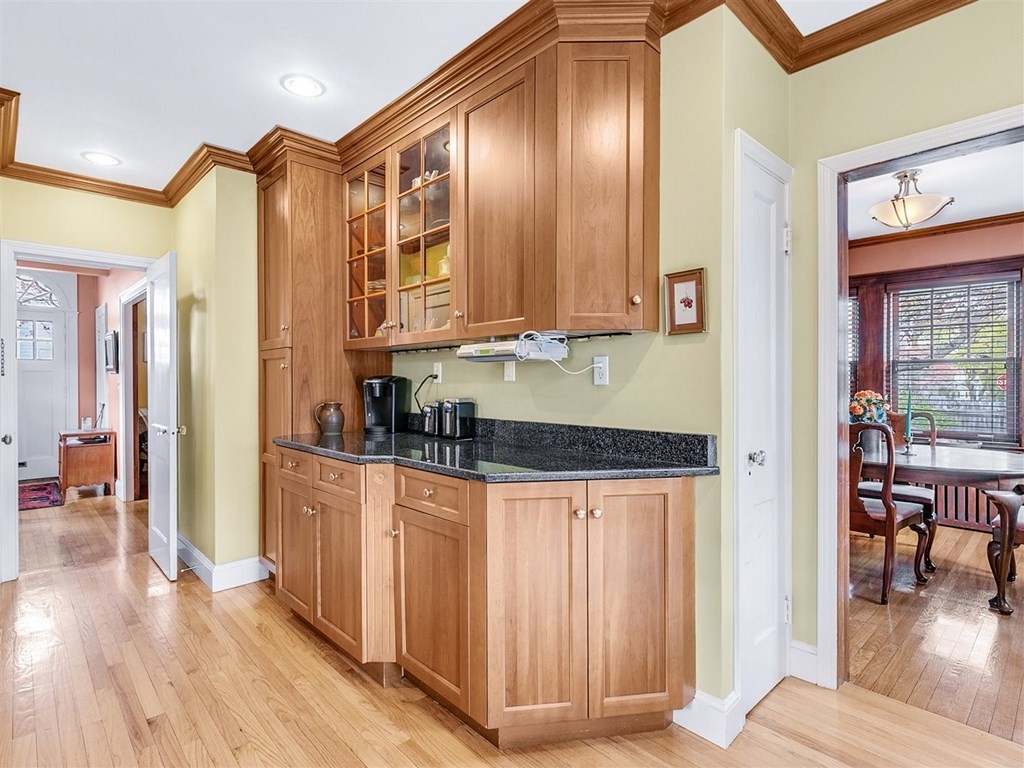 4 Brier Road Boston, MA 02132 - Photo 20 of 34 a kitchen with stainless steel appliances granite countertop a refrigerator a stove and a wooden cabinets