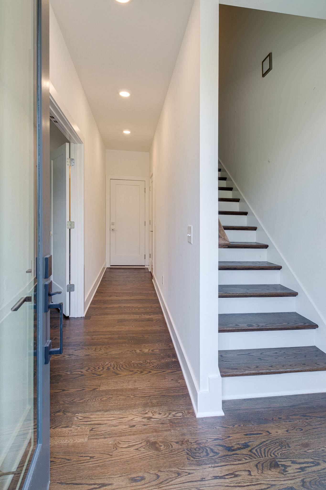 3746 Central Pike, Unit 13 Hermitage, TN 37076 - Photo 3 of 32 a view of a hallway with wooden floor and staircase