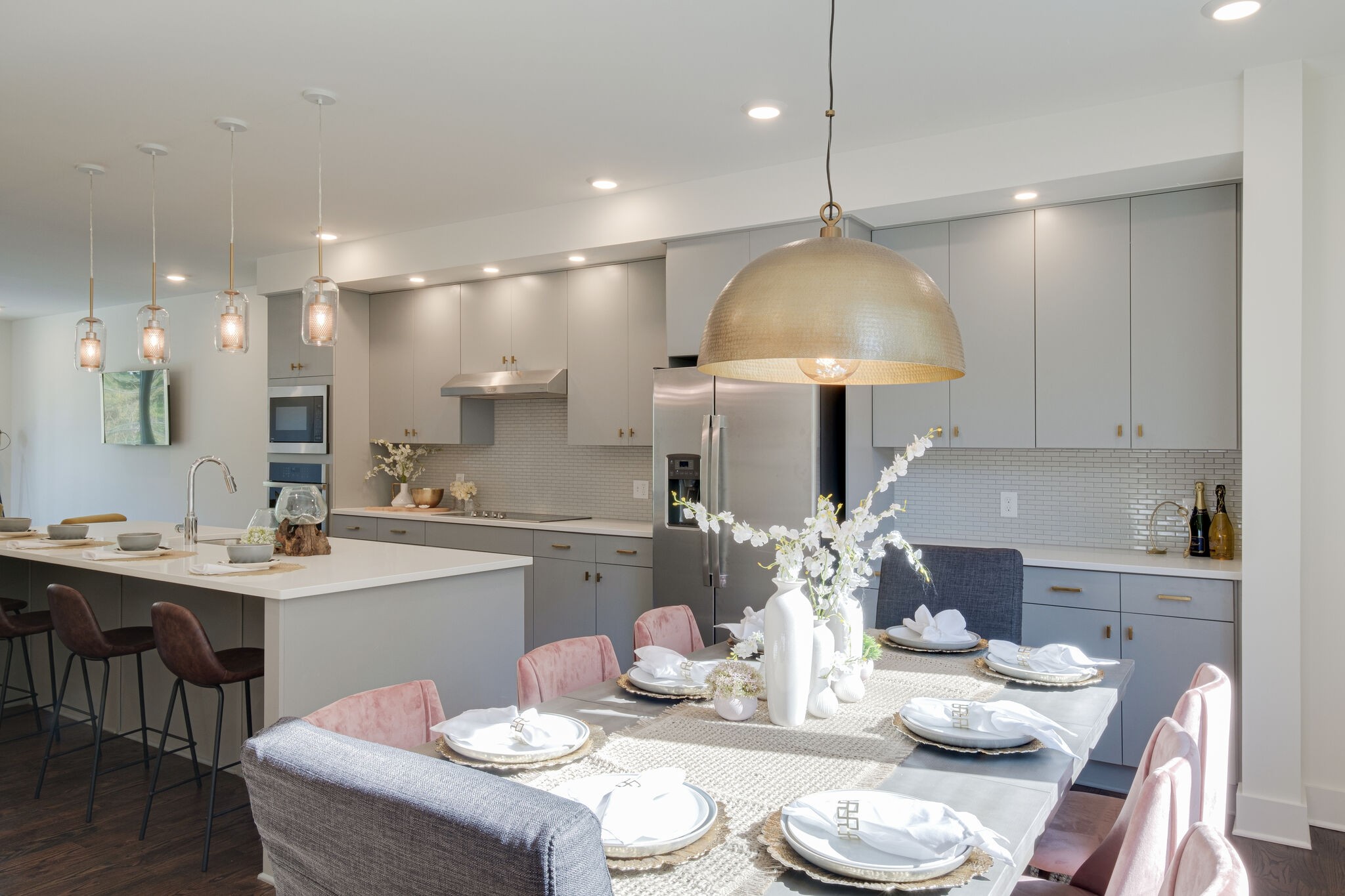 3746 Central Pike, Unit 13 Hermitage, TN 37076 - Photo 4 of 32 a kitchen with stainless steel appliances kitchen island granite countertop a sink and a dining table with wooden floor