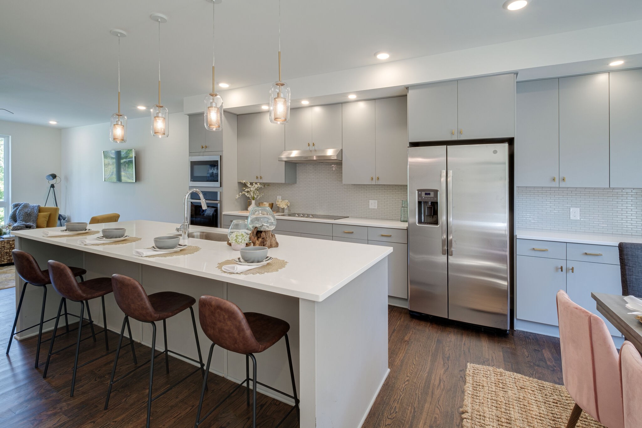 3746 Central Pike, Unit 13 Hermitage, TN 37076 - Photo 6 of 32 a kitchen with stainless steel appliances a table and chairs in it