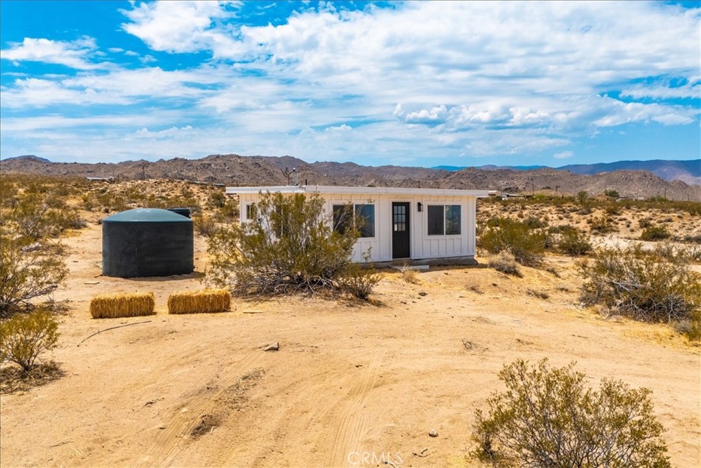 777 Quail Bush Road Landers, CA 92285 - Photo 32 of 46 a view of a terrace with wooden fence