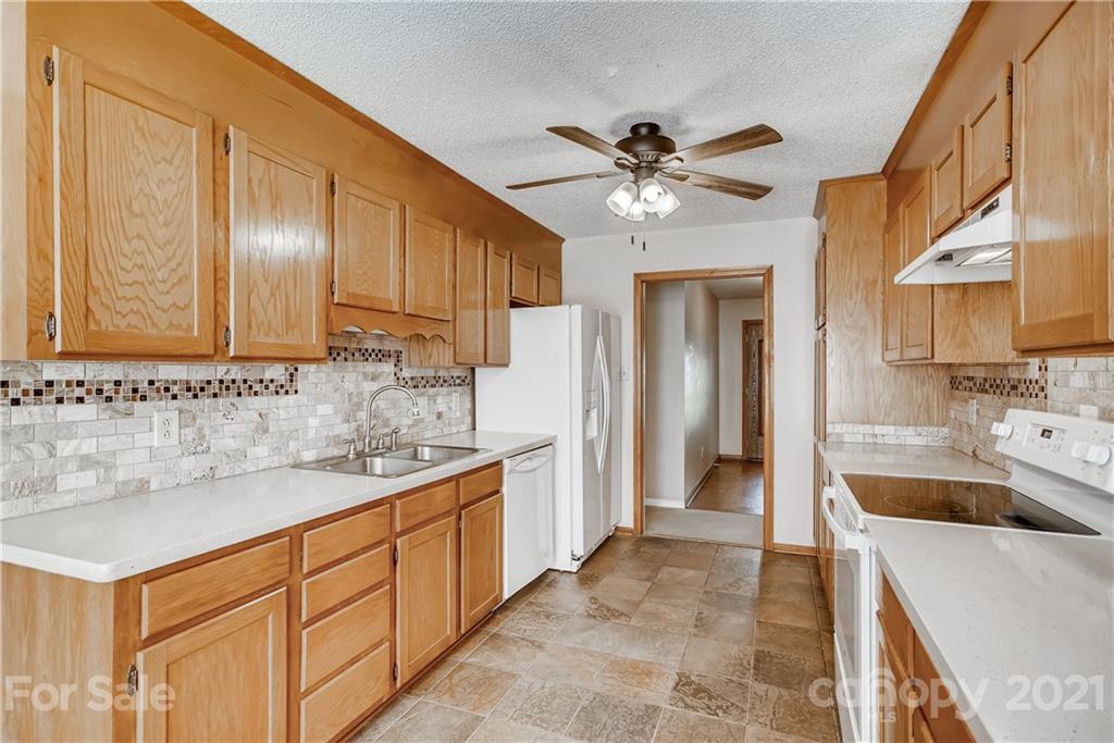 619 Breckenridge Road Kannapolis, NC 28083 - Photo 12 of 33 a kitchen with a sink cabinets and window