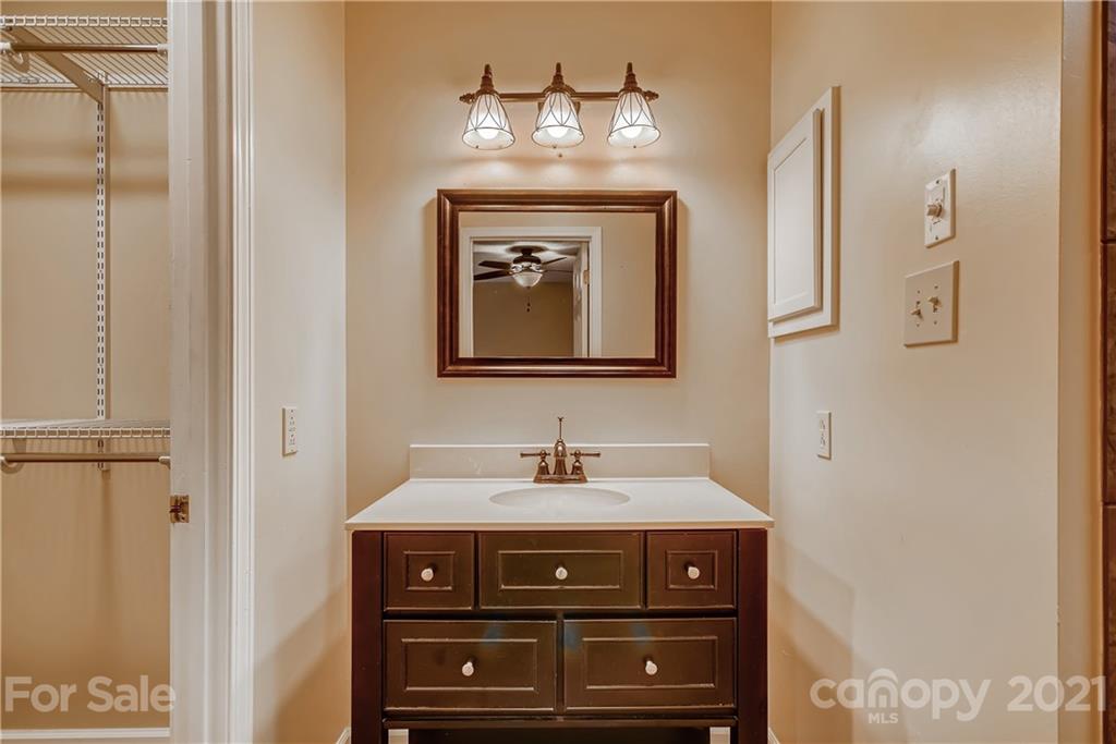 619 Breckenridge Road Kannapolis, NC 28083 - Photo 18 of 33 a bathroom with a sink and a mirror