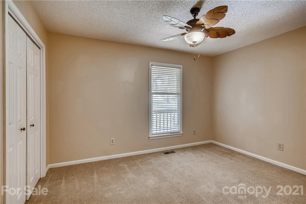 619 Breckenridge Road Kannapolis, NC 28083 - Photo 21 of 33 an empty room with windows and fan