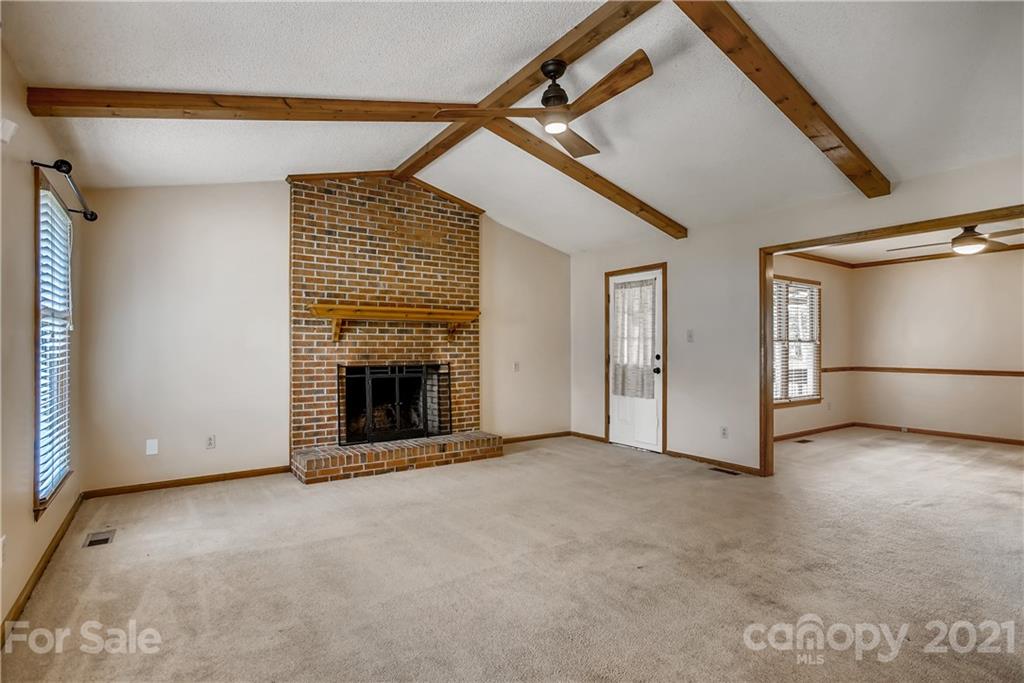 619 Breckenridge Road Kannapolis, NC 28083 - Photo 5 of 33 a view of an empty room with a fireplace and a window