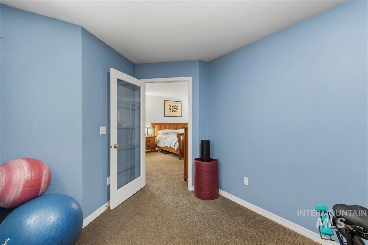 8001 West Innsbrook Court Boise, ID 83704 - Photo 21 of 39 Carpeted interior room featuring light blue walls and white baseboards