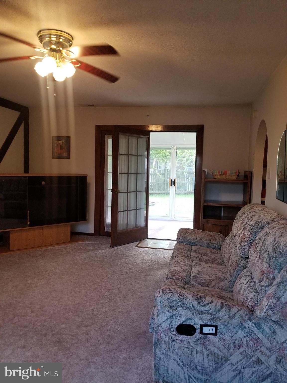 5752 Van Dyke Road Baltimore, MD 21206 - Photo 7 of 30 Ceiling Fan , carpeting with door to sunroom
