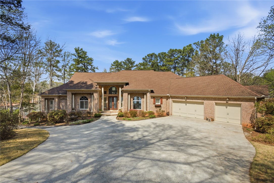 610 Highridge Drive Seneca, SC 29672 - Photo 1 of 50 This magnificent brick residence features an expansive driveway and a multi-car garage, nestled among mature trees.