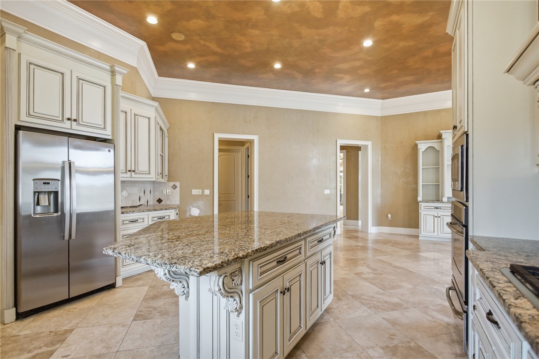 610 Highridge Drive Seneca, SC 29672 - Photo 15 of 50 This spacious kitchen offers ample granite counter space, an island, and sleek stainless steel appliances.