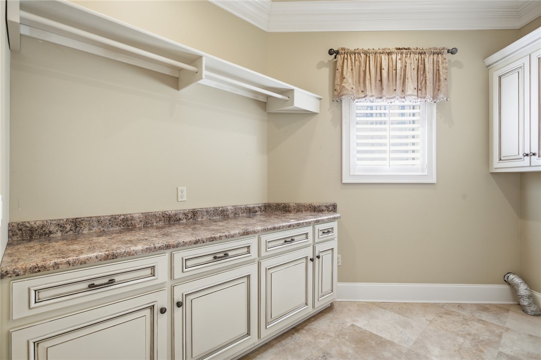 610 Highridge Drive Seneca, SC 29672 - Photo 23 of 50 This laundry room features ample counter space and storage for all your household needs.