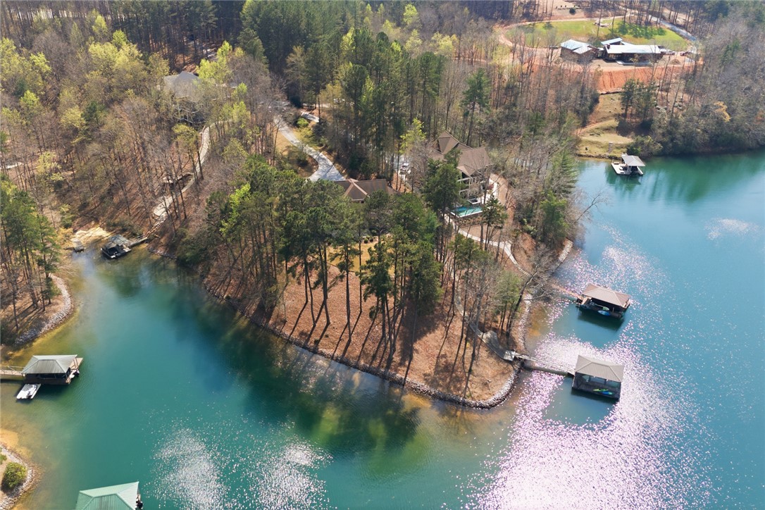 610 Highridge Drive Seneca, SC 29672 - Photo 3 of 50 This aerial view showcases a tranquil Lake Keowee home with private dock and lush surroundings.