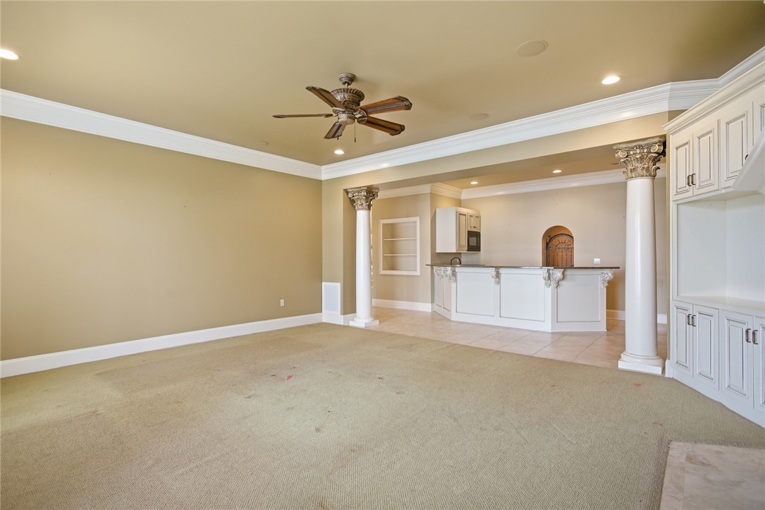 610 Highridge Drive Seneca, SC 29672 - Photo 43 of 50 This spacious downstairs living area offers a convenient wet bar, perfect for entertaining guests.