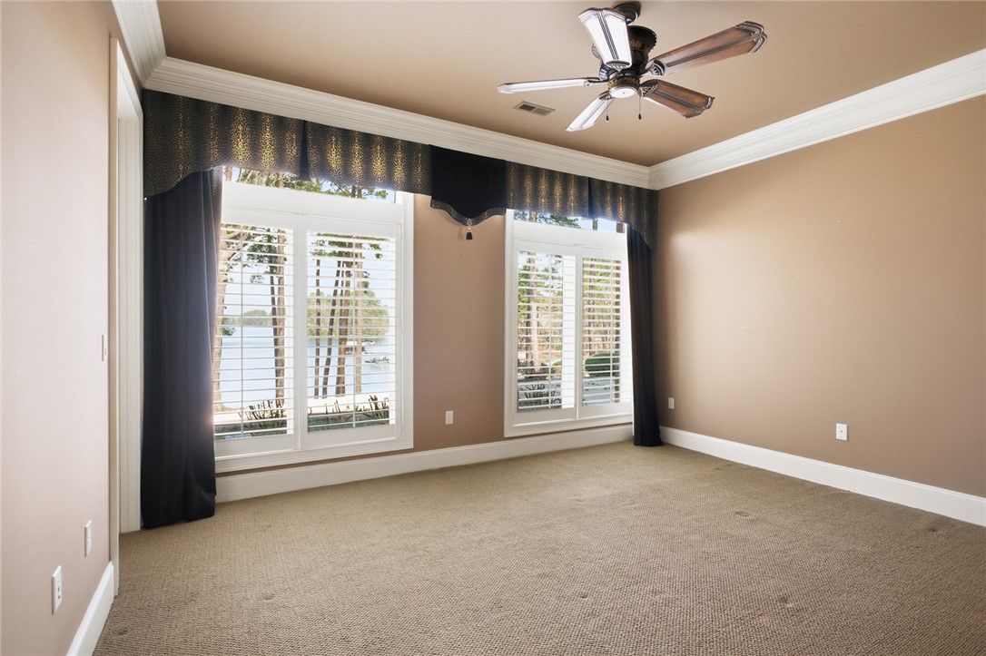610 Highridge Drive Seneca, SC 29672 - Photo 45 of 50 This spacious room offers tranquil Lake Keowee views through elegant window treatments.