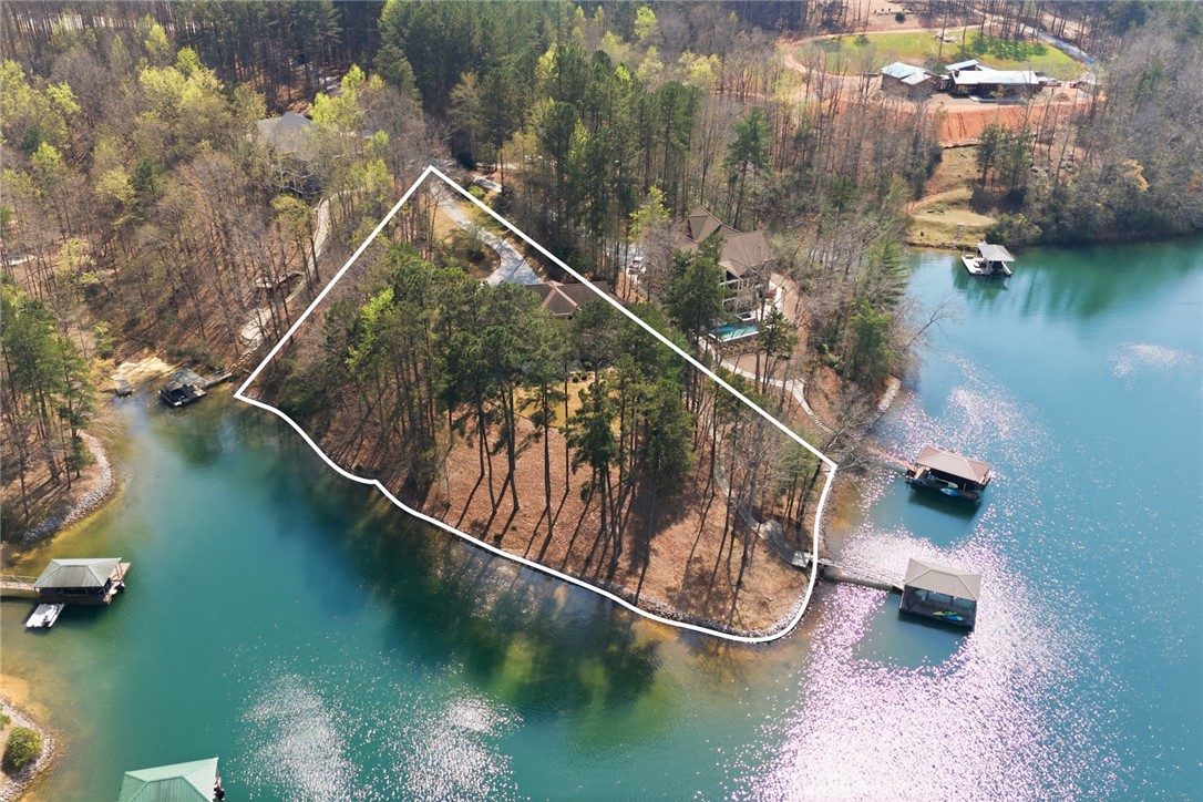 610 Highridge Drive Seneca, SC 29672 - Photo 50 of 50 This aerial view showcases a picturesque waterfront property with lush trees and serene Lake Keowee access.