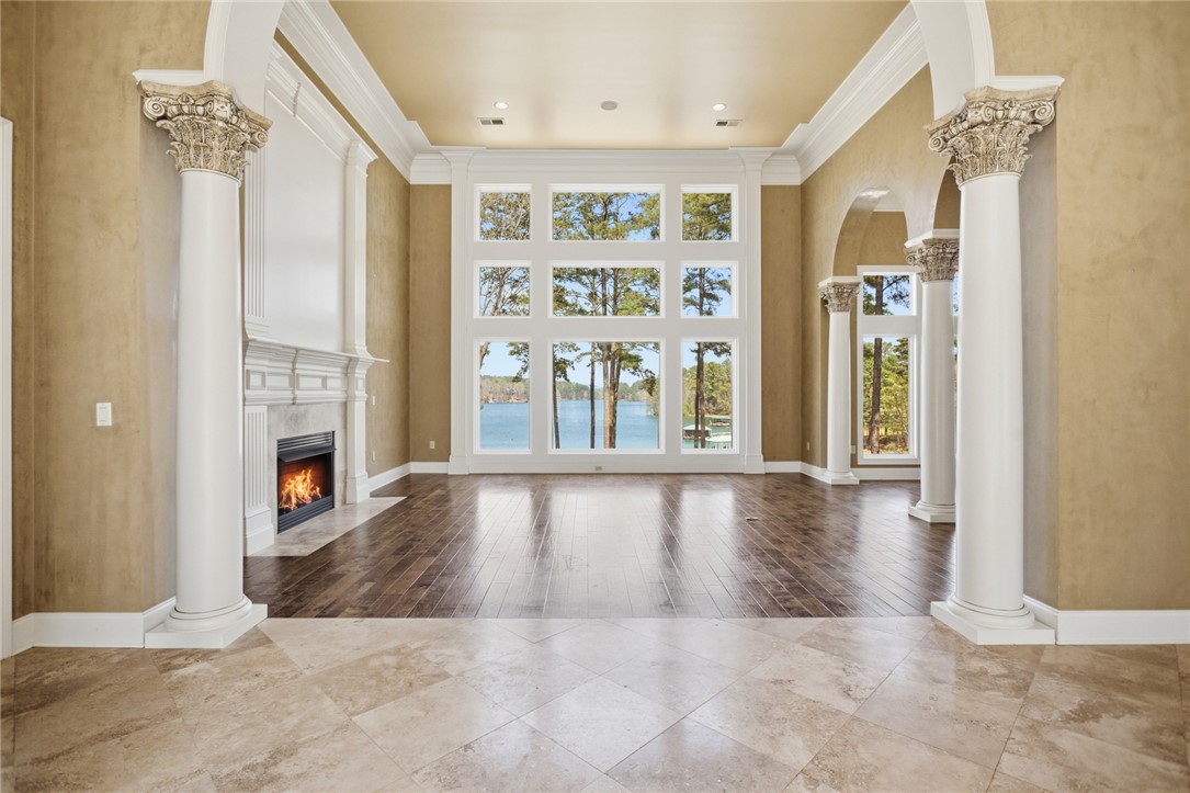 610 Highridge Drive Seneca, SC 29672 - Photo 5 of 50 This living area offers a breathtaking lake view, a fireplace, and elegant architectural columns.