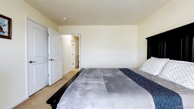 a spacious bathroom with a tub sink and mirror